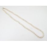 A pearl necklace with 14ct gold clasp. 24" long Please Note - we do not make reference to the
