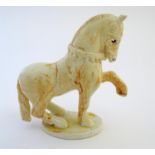 A Paula Humphries studio pottery model of a horse on an oval base. Marked under with impressed bee
