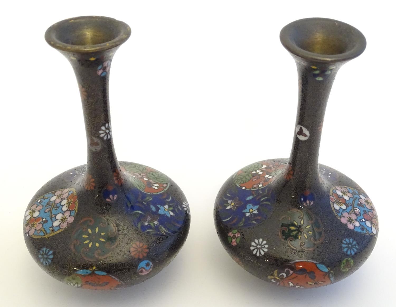 A pair of early 20thC cloisonne bottle vases with elongated necks and flared rims, with floral - Image 4 of 9