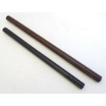 Treen: A 20thC turned walnut cylindrical rolling rule. Together with an ebony example, the ends