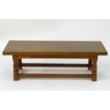 A mid 20thC oak Alan 'Acornman' Grainger coffee table, with a rectangular top above four canted