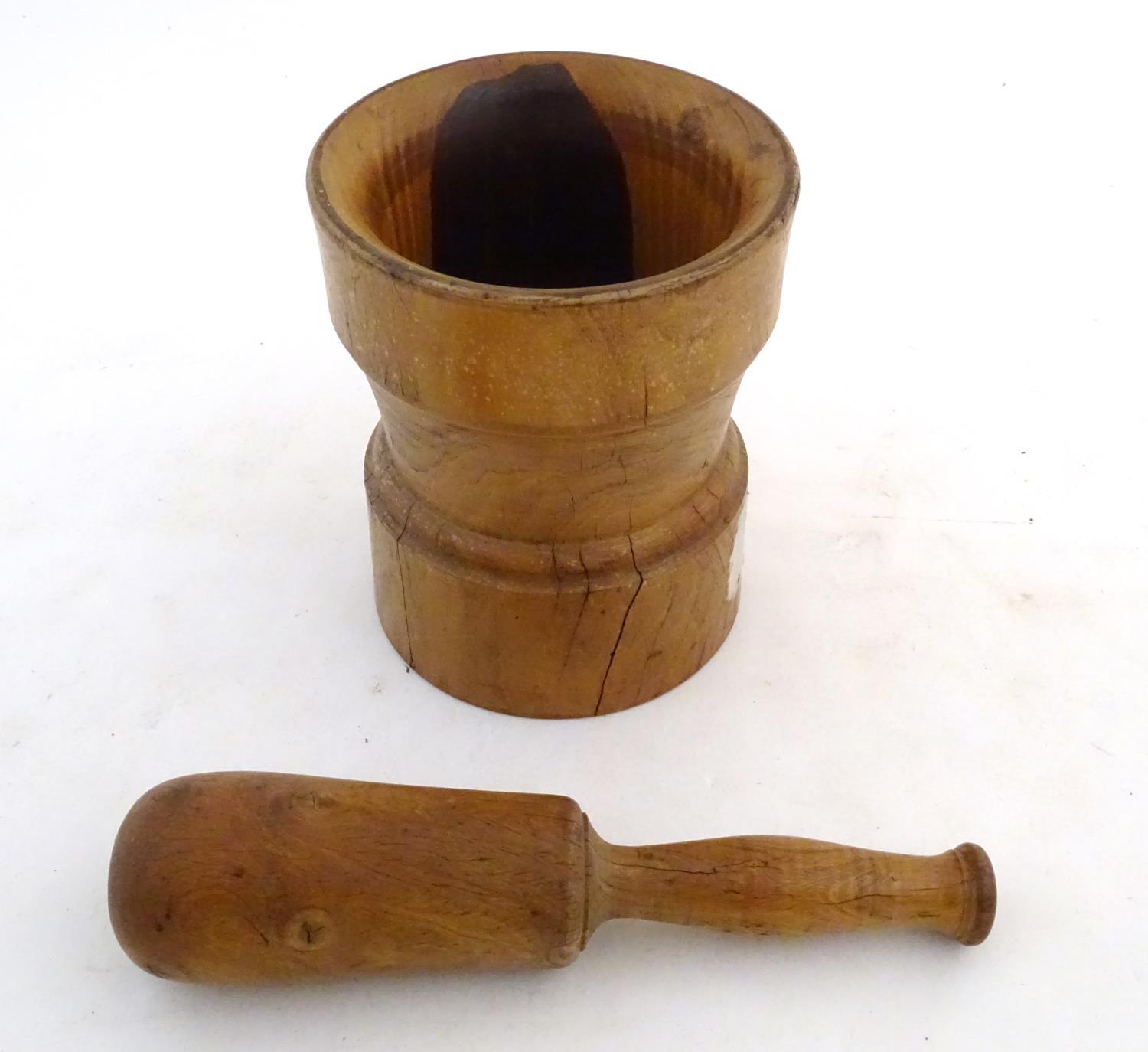 Kitchenalia: a continental 19thC Treen turned elm pestle and mortar, measuring 9 3/4" and 6 3/4"