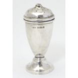 A silver pepper pot hallmarked Birmingham 1933 maker A L Davenport Ltd. 3 1/2" high Please Note - we