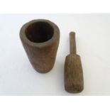 Kitchenalia: a 19thC carved walnut pestle and mortar, of large proportions and roughly finished, the