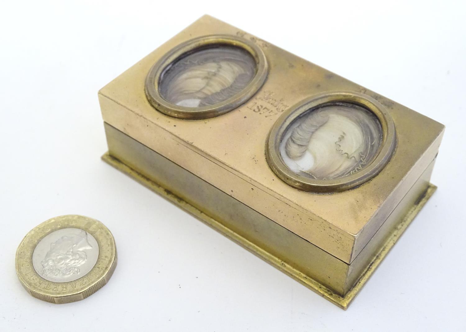 An unusual Victorian gilt metal box set with twin oval locket sections to lid containing locks of - Image 5 of 15