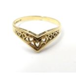 A 9ct gold ring whith heart detail. Ring size approx L 1/2 Please Note - we do not make reference to