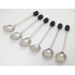 A set of 6 silver coffee spoons with coffee bean decoration to handles. Hallmarked Sheffield 1950