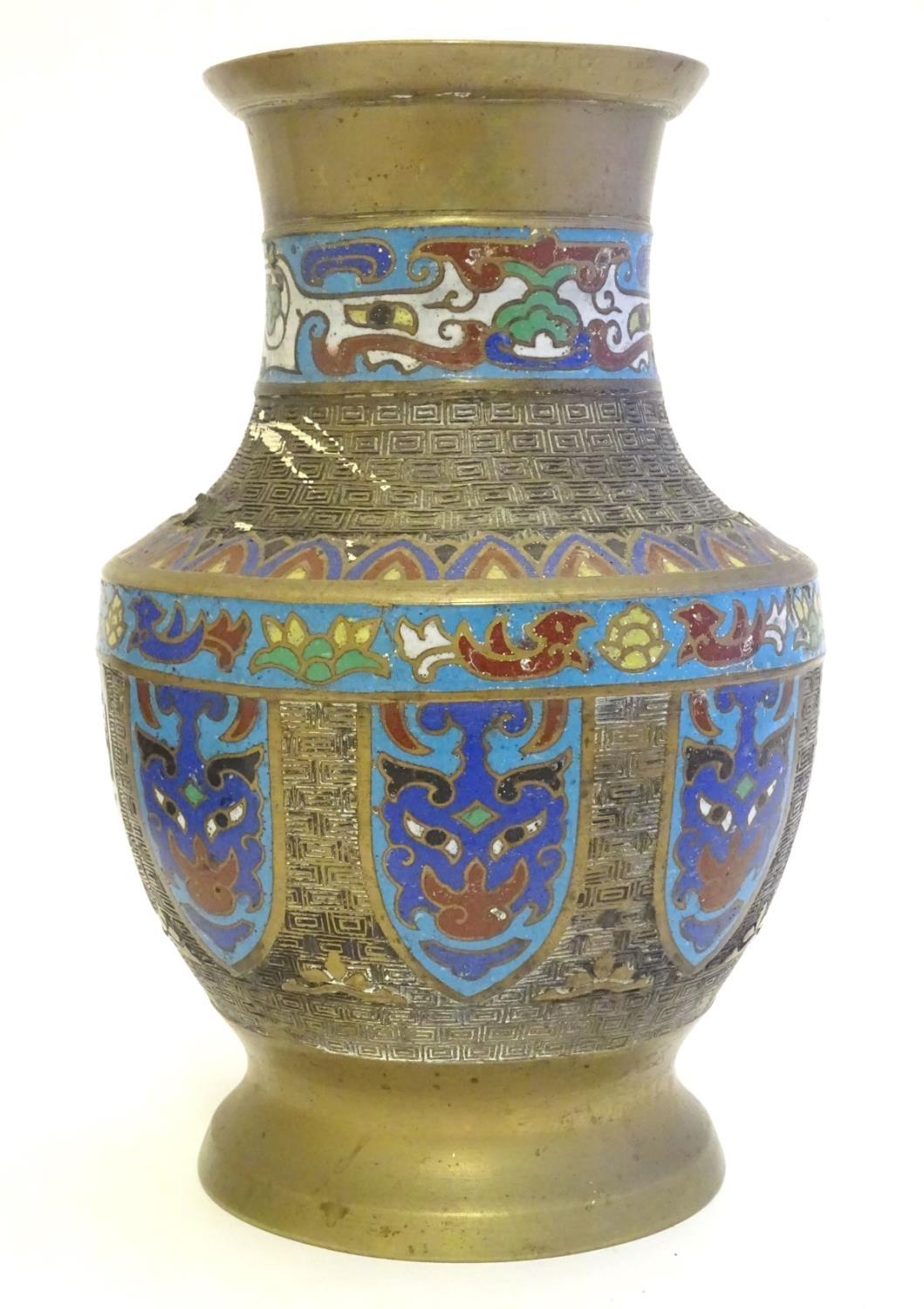 A Japanese brass vase of baluster form with Cloisonné mask and shield decoration to sides. Approx. 9 - Image 8 of 9