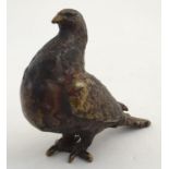 A 20thC bronze model of a pigeon, signed H.S. under. Approx. 4" high Please Note - we do not make