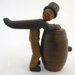 A mid-20thC Bavarian/Black Forest novelty tobacco pot, formed as an inebriated caricature in top hat