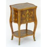 A 19thC satinwood ladies writing table with a shaped top and three short drawers all having floral