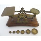 A set of Victorian postal scales with 6 weights. Approx. 3 3/4" high overall. Please Note - we do