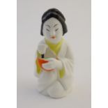 A Royal Worcester figural candle snuffer modelled as a Japanese girl. Marked within. Approx. 3" high