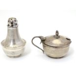 An Art Deco silver encased pepperette and mustard pot (silver over Bakelite.) Both hallmarked for
