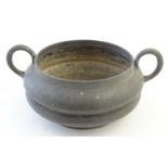 A Tudric pewter twin handled bowl with a waisted body. Marked under, no. 0488. Approx. 2 3/4" high