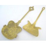 Two Georgian brass skimmers, both shaped and pierced with two copper rivets securing the handle to