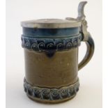 A Rosenthal tankard / beer stein with incised flower decoration to the body, designed by Bjorn