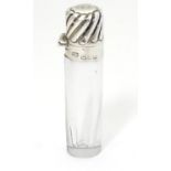 A glass scent / perfume bottle with silver mount hallmarked Sheffield 1899 2 3/4" high Please Note -