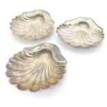 A set of three Elkington Plate silver plate butter dishes of Scallop shell form with engraved