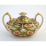 A Royal Crown Derby Imari style twin handled sucrier / sugar bowl and cover, model no. 2451.