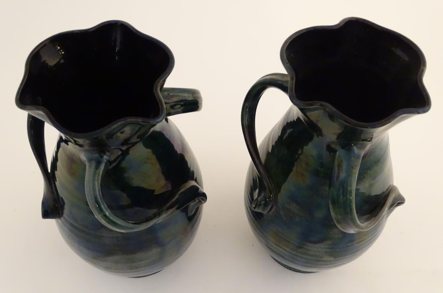 A pair of Baron Barnstaple art nouveau vases in a lustre glaze, with lobed rims and three twisted - Image 5 of 9