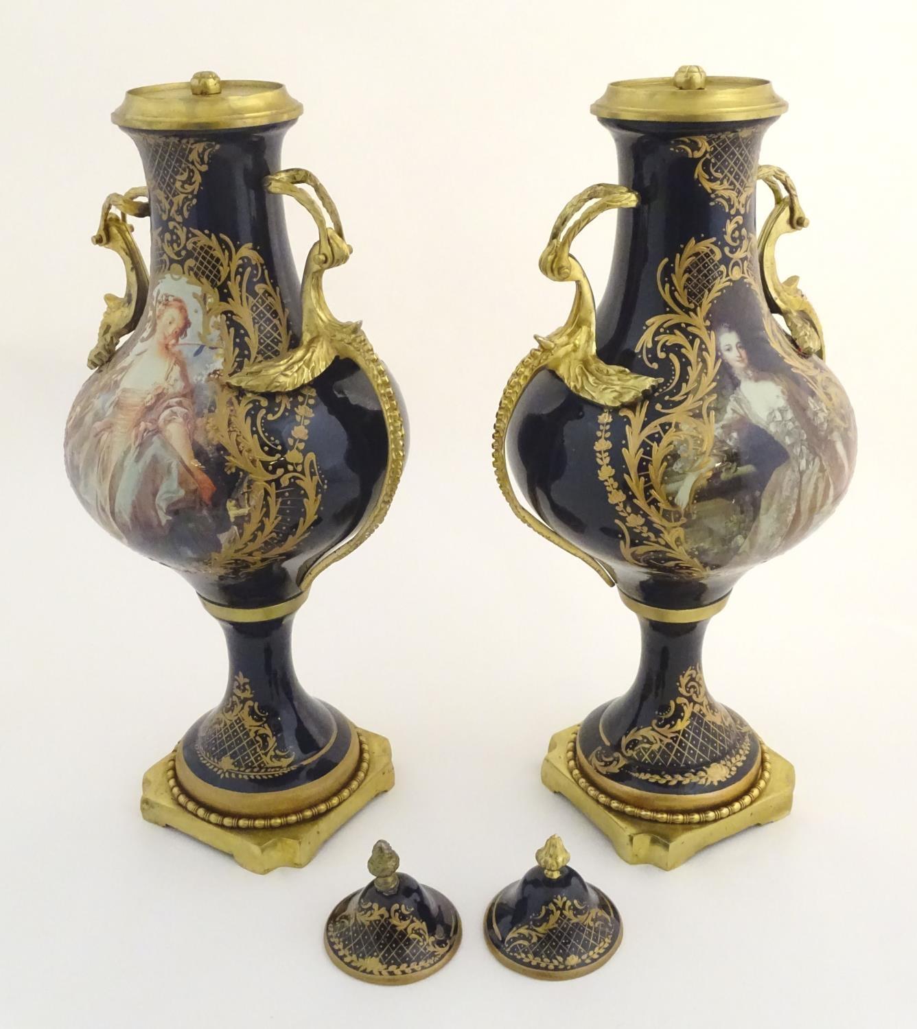 A matched pair of Sevres style lidded urn garnitures on mounted bases, with cobalt blue - Image 6 of 11