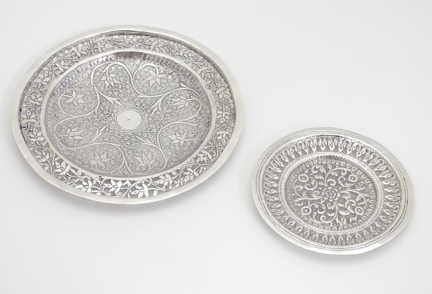 Two white metal dishes with floral and foliate decoration. The largest 6" diameter Please Note -