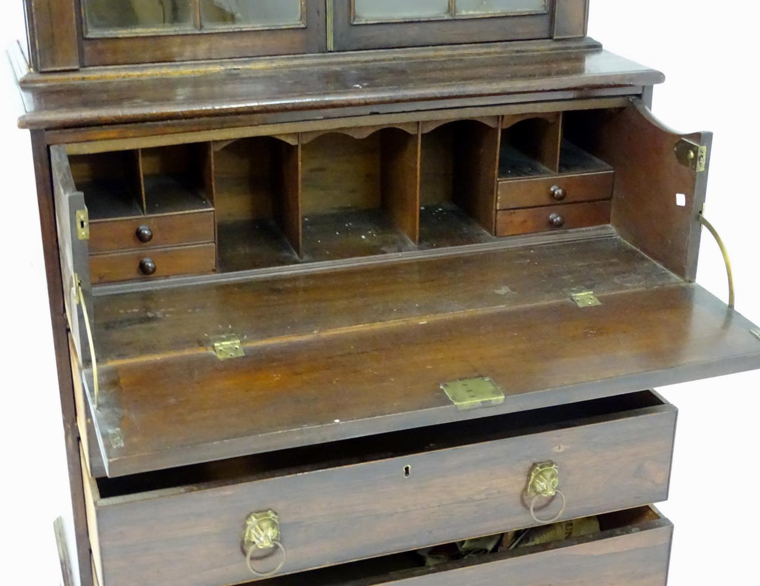 An early 19thC rosewood secretaire bookcase with an arched pediment above two astragal glazed doors, - Image 6 of 8