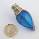 A 21stC novelty blue glass scent bottle, of drop form with metal top formed as the head of an owl. 2