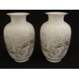 A pair of Chinese baluster vases with flared rims, with transfer decoration depicting winter