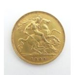 A 22ct gold 1909 Edward VII half sovereign coin, approximately 4g Please Note - we do not make
