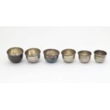 A graduated / nested set of six .900 silver small cups / sake cups. Largest approx. 1 1/2"