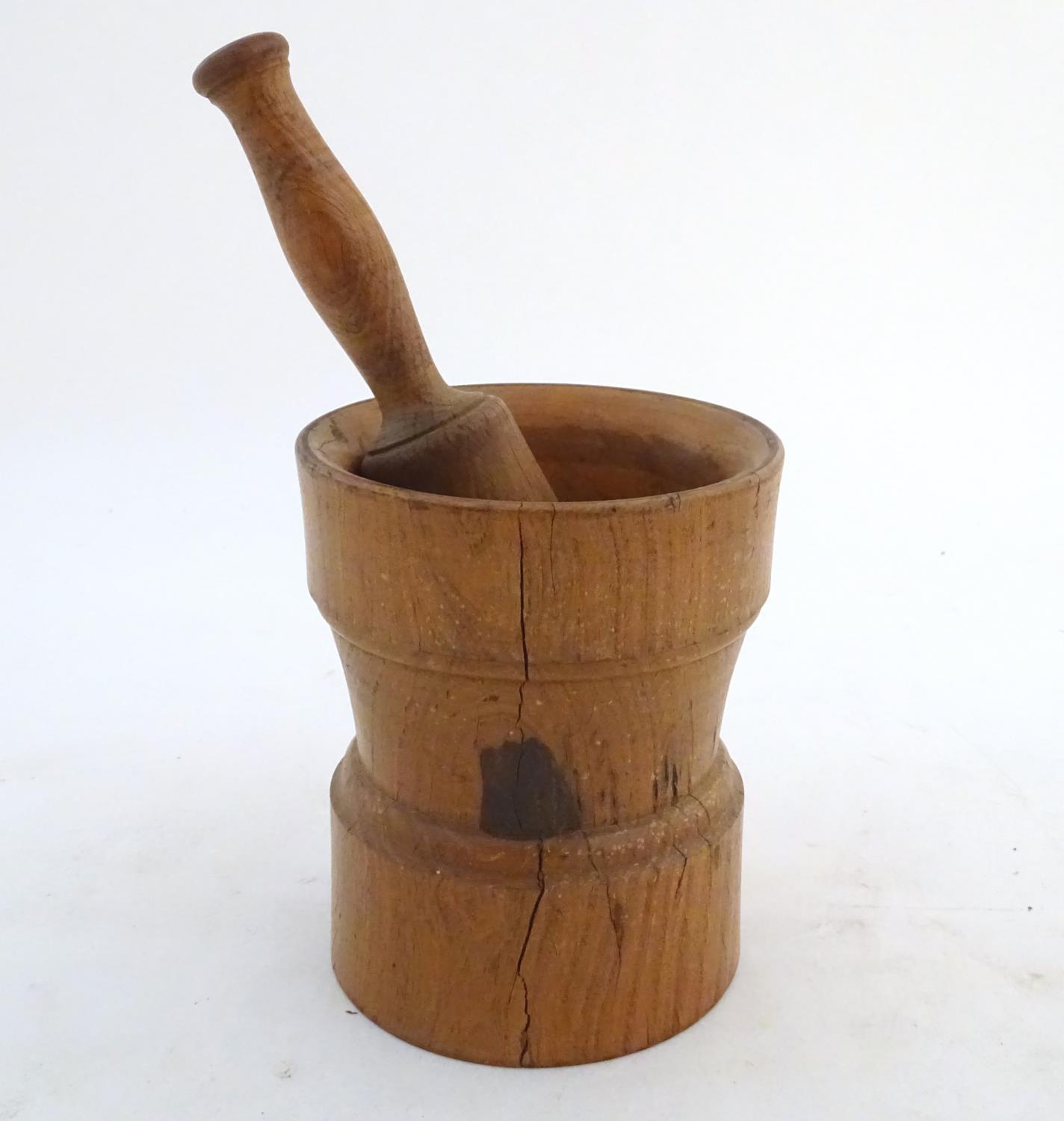 Kitchenalia: a continental 19thC Treen turned elm pestle and mortar, measuring 9 3/4" and 6 3/4" - Image 4 of 5