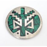 A Mexican silver brooch of circular form with with malachite detail 2" diameter. Please Note - we do