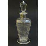 Glass: a silver collared glass scent bottle with etched floral decoration and glass stopper.
