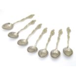 A set of 7 Japanese white metal teaspoons with dragon detail. Marked 84 Moji. Approx 5" long