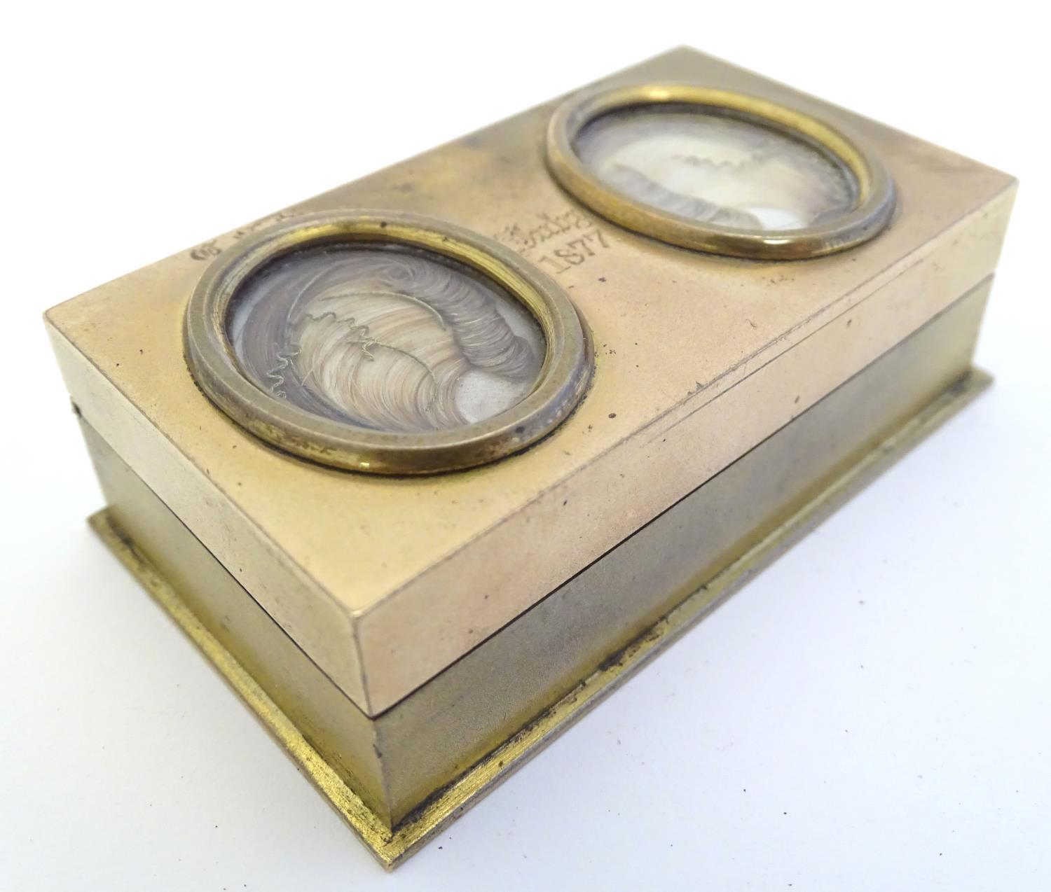 An unusual Victorian gilt metal box set with twin oval locket sections to lid containing locks of - Image 9 of 15