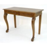 A late 19thC oak serving table with a rectangular moulded top above a moulded frieze and carved
