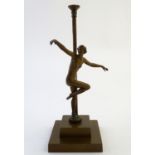 Lighting: an Art Deco brass table lamp, decorated with a figurine and standing on a stepped base. 13