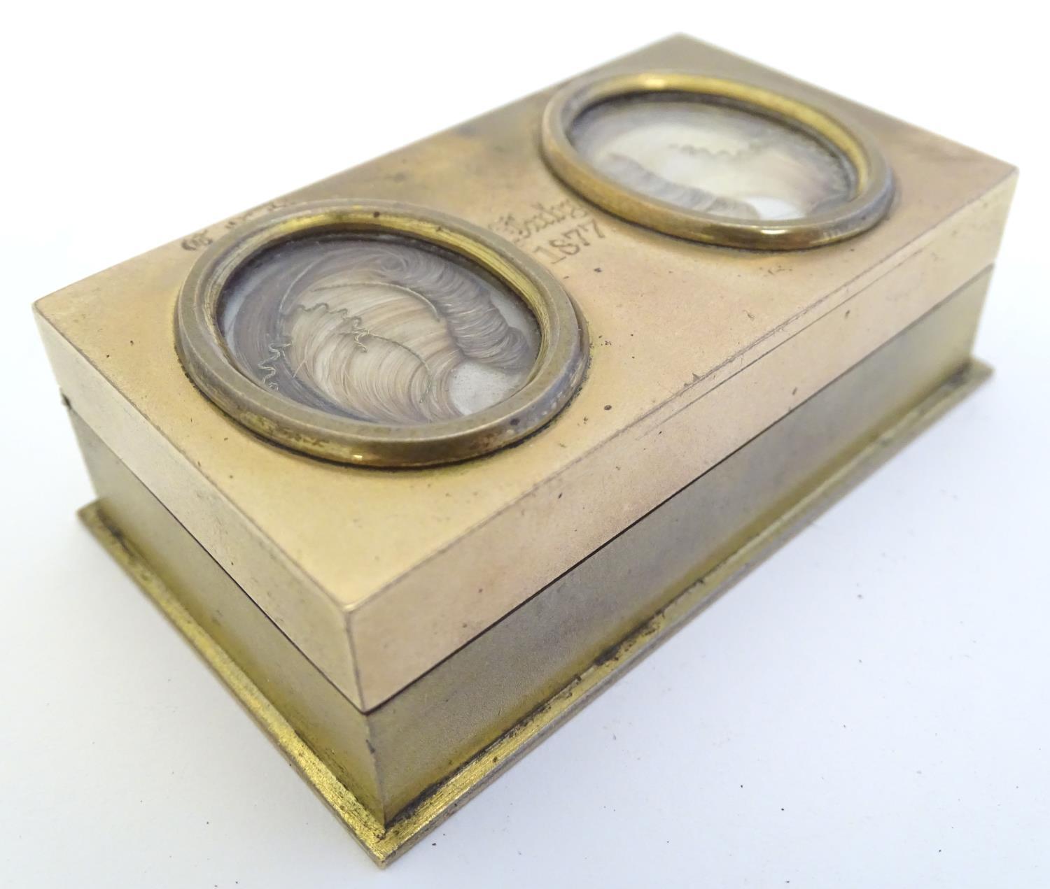 An unusual Victorian gilt metal box set with twin oval locket sections to lid containing locks of - Image 3 of 15