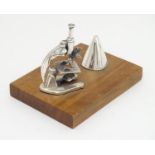 A Continental .925 silver miniature model of a microscope etc. mounted on a wooden base. Approx.