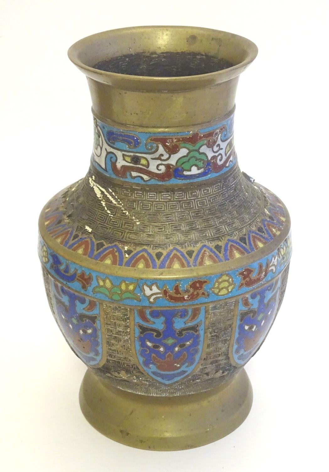 A Japanese brass vase of baluster form with Cloisonné mask and shield decoration to sides. Approx. 9 - Image 7 of 9