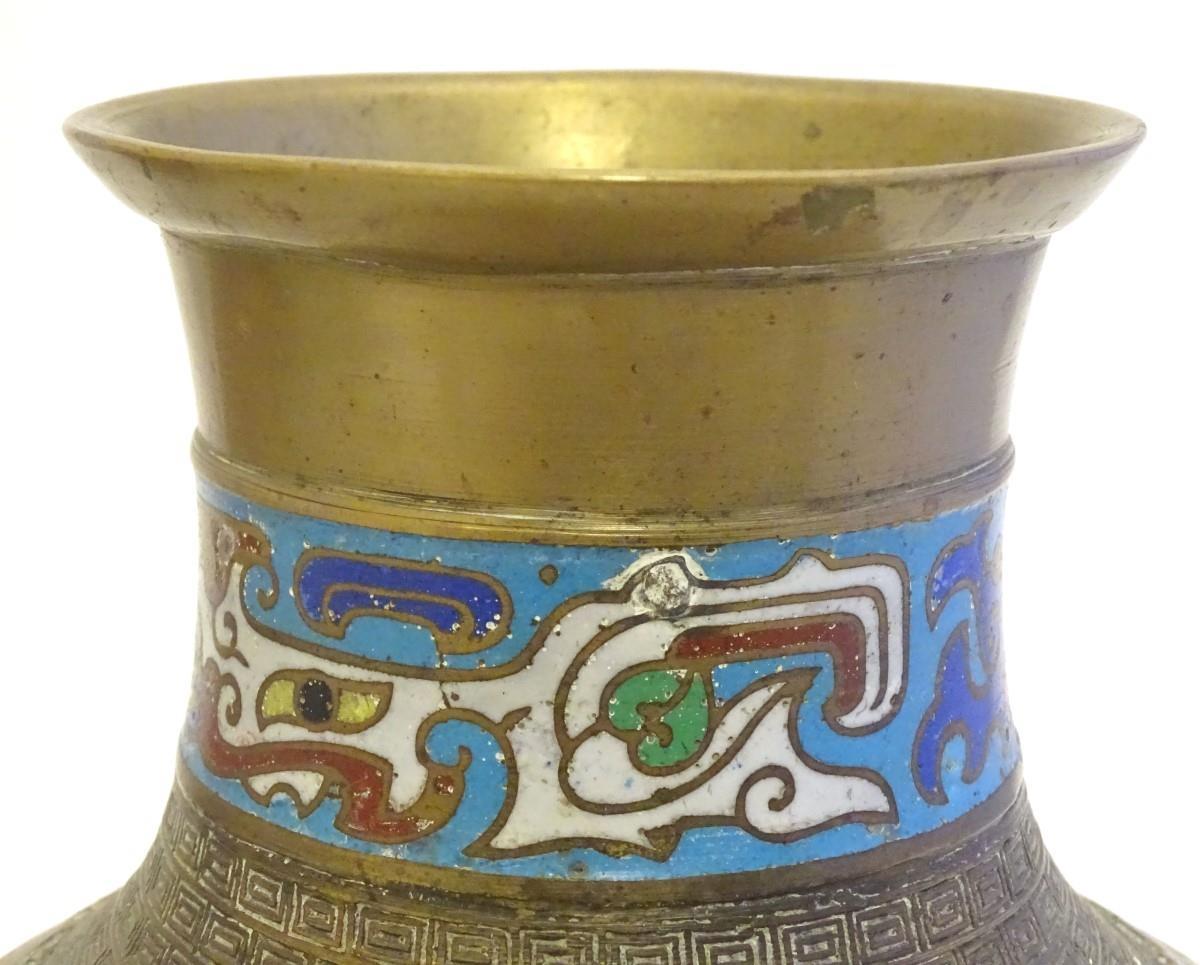 A Japanese brass vase of baluster form with Cloisonné mask and shield decoration to sides. Approx. 9 - Image 6 of 9