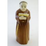 A Royal Worcester figural candle snuffer modelled as a Franciscan monk. Marked within. Approx. 5"