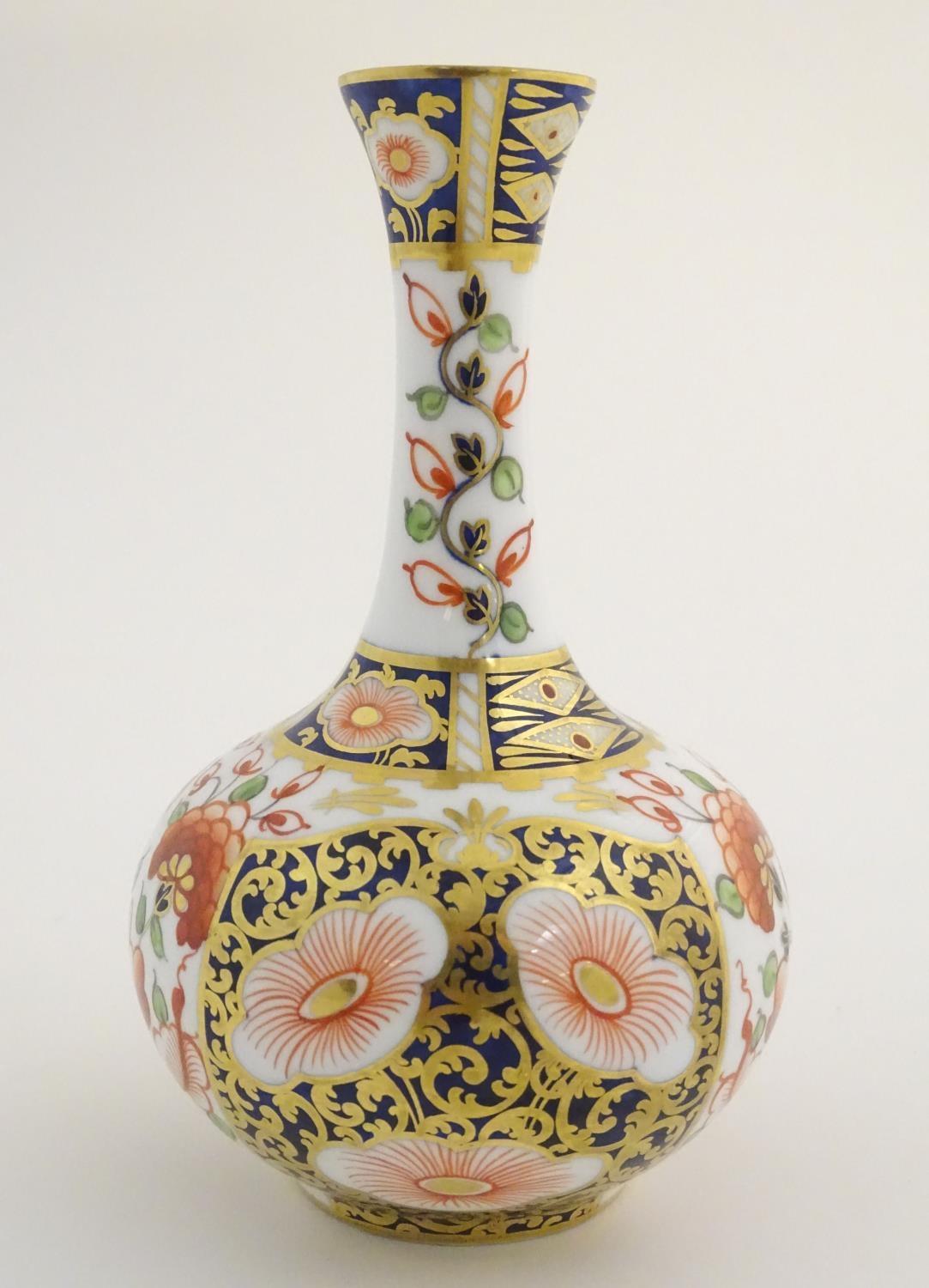 A 19thC Stevenson and Hancock Derby vase decorated with flowers in the Imari palette. Marked