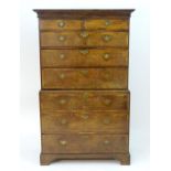 An 18thC oak chest on chest with a moulded cornice above two short over six long graduated drawers