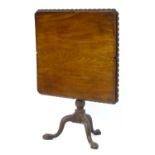 A rare mid 18thC mahogany tilt top table with an unusual moulded surround, re-entrant corners and