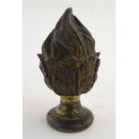 A cast bronze finial formed as a flame / torch with gilt highlights. Approx. 5 1/2" high Please Note