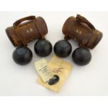 Two pairs of Henselite standard lawn bowls, South African Model. Each pair contained within a