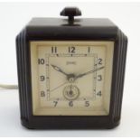 Clocks: an early-to-mid 20thC Art Deco electric alarm clock by Ferranti, England, with bakelite